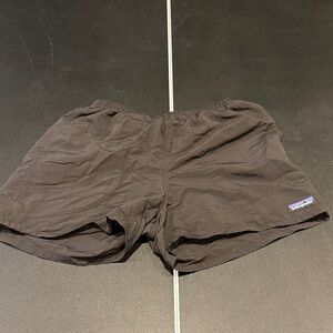 Patagonia Black Shorts with the liner removed

White pain on the back